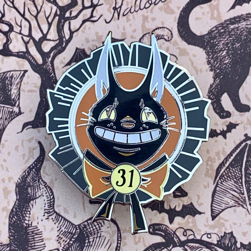 Retro Black Cat Halloween pin, 1.25 inches in size. Features a silver finish, glow-in-the-dark enamel, and screen printed accents. Double post design with rubber clutches.